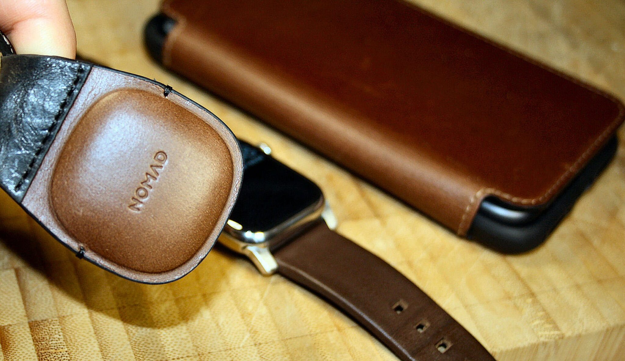 Nomad Goods Apple Watch Foilio case and brown active strap pro and airtag